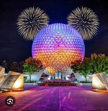 "Disney's iconic EPCOT globe illuminated by the spectacular fireworks display; a gentle reminder that amazing views and memories don't have to burn the wallet!"